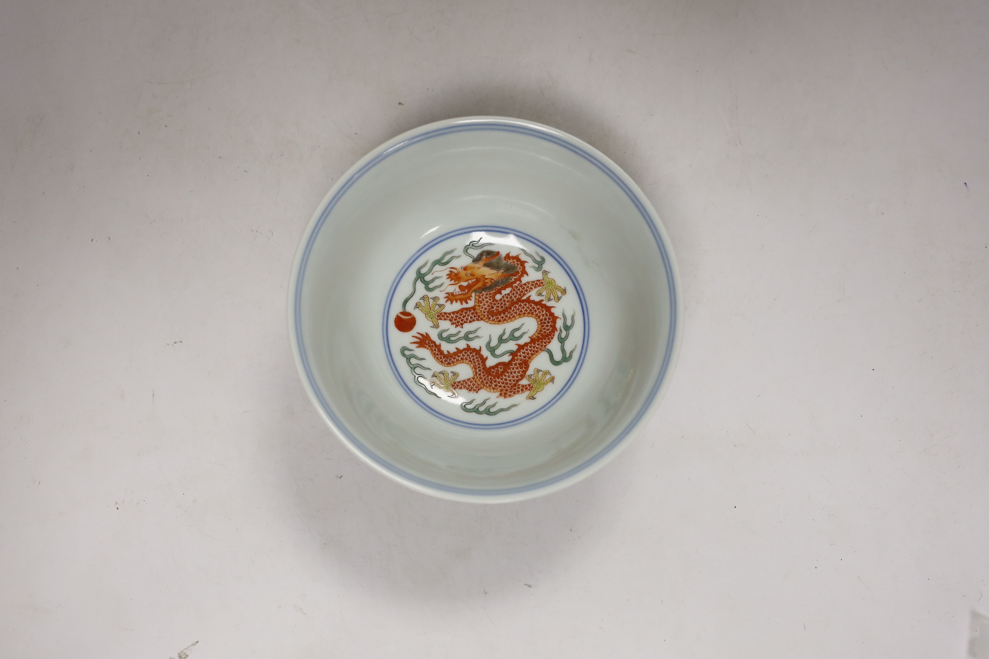 A Chinese wucai 'dragon & phoenix ' bowl, Qianlong mark but later, 16cm